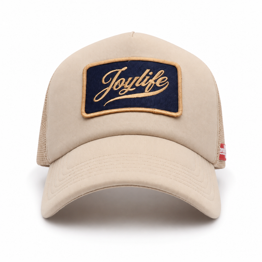 Cream Navy cap angled view with curved visor