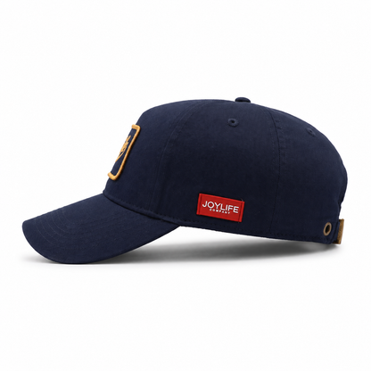 JOYLIFE Navy Gold cap side profile with navy crown and adjustable back detail