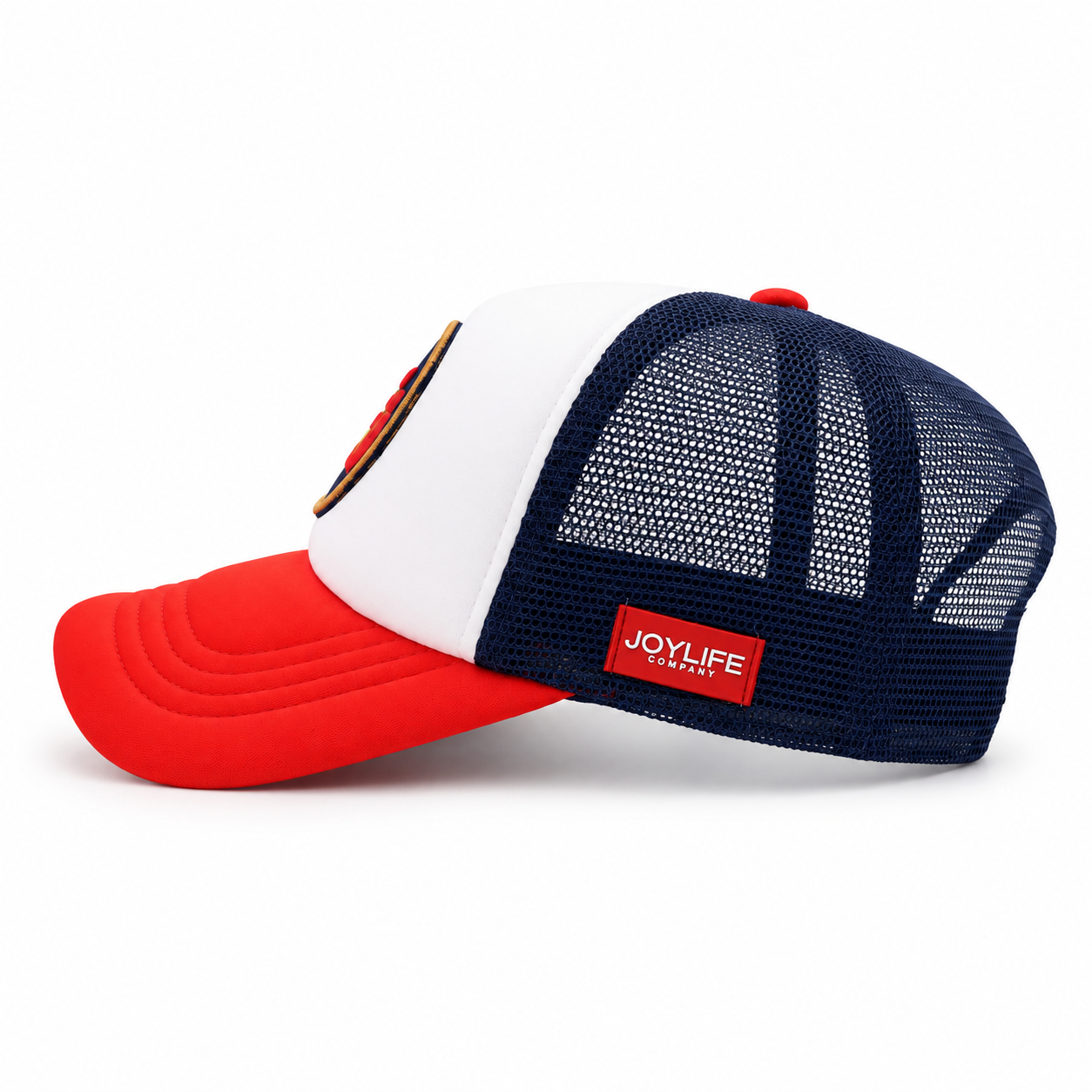 Side view of trucker cap with navy mesh back and red side label
