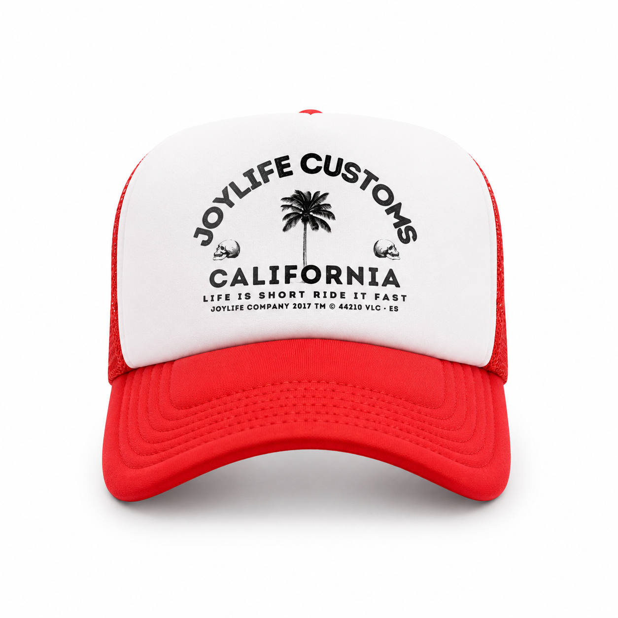 Angled view of white trucker cap with red visor and mesh panels
